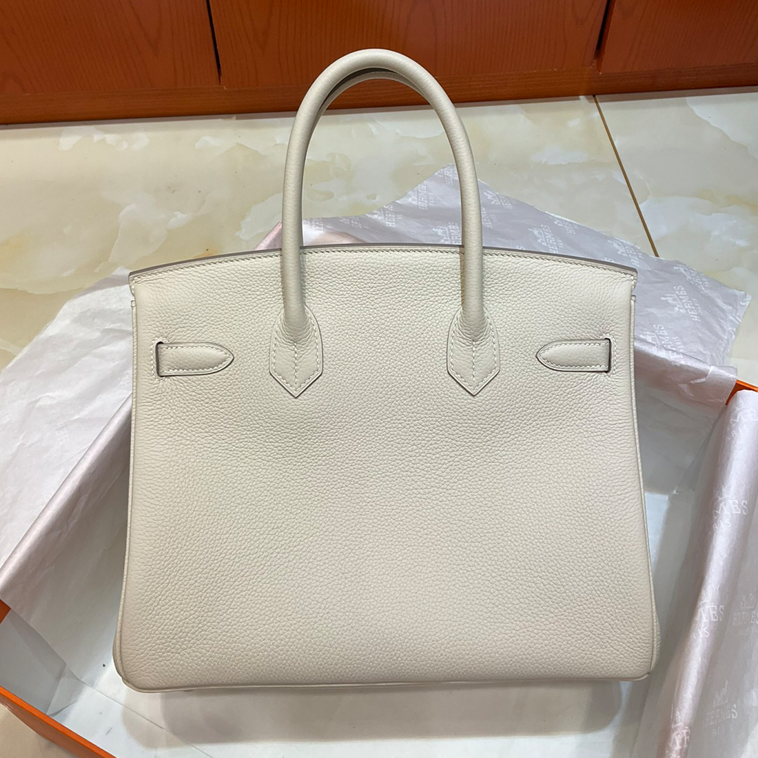Milkshake White Medium Structured Top Handle Bag With Pebble Grain Surface And Polished Silvery Twist-Lock Hardware