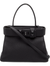Solid Black Trapezoidal Top Handle Bag With Pyramid Stud Front Hardware, Pebbled Textured Body And Base Protective Metal Studs