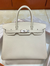 Milkshake White Medium Structured Top Handle Bag With Pebble Grain Surface And Polished Silvery Twist-Lock Hardware