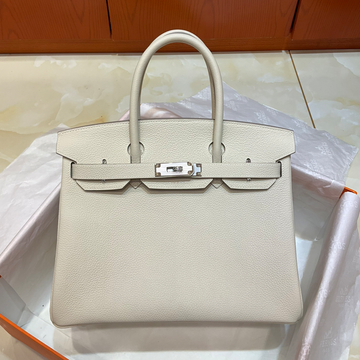 Milkshake White Medium Structured Top Handle Bag With Pebble Grain Surface And Polished Silvery Twist-Lock Hardware